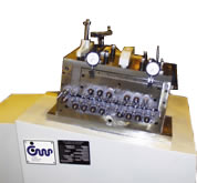 8in. small parts straightener with backed up rolls, Dial indicators and slope top cabinet